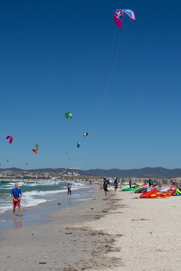 kitesurfers on a beach