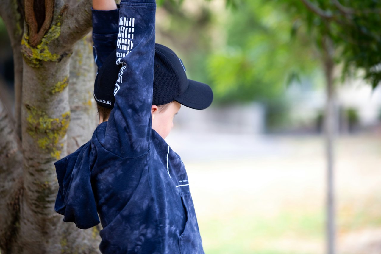 woman climbing tree